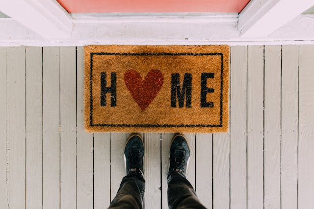a doormat that says home
