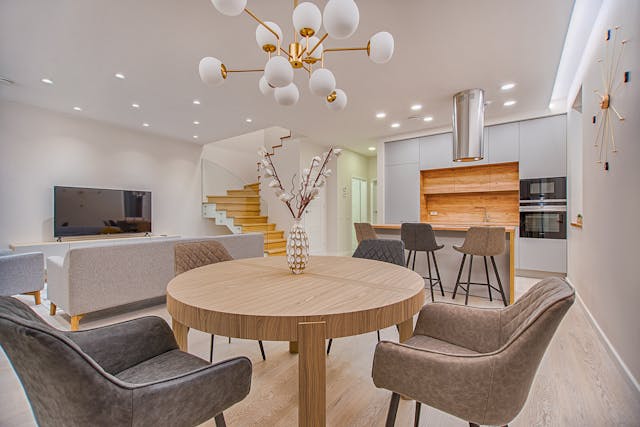 neutral-colored-living-woom-with-white-cupboards-and-a-wooden-table