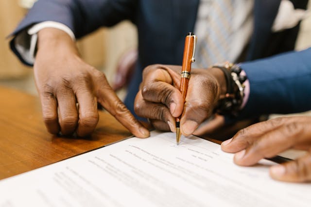 a man signing a document